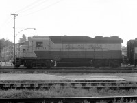 CP 5001, one of 2 GP30's sold in Canada, is just starting the afternoon freight moving at Trois-Rivieres, returning to Montreal with quite a number of newsprint boxcars loaded at the local paper mills and other freight. The trailing unit on this occasion is an FA-2.<br>
In 1970 I saw predominantly 4-axle MLW units on the afternoon freight returning to Montreal from Trois-Rivieres. Three units was typical, otherwise 2 or 4; they would include mixtures of RS11, RS10, RS3, FA, FB, and C424. Other than the occasional freight FP7A, the first GM unit I encountered was the GP35 - I heard its turbo-supercharger whine as I bicycled along the road beside the roundhouse, and wondered what I was about to see.
This GP30 was obviously related but styled differently from the GP35, while its CP class id plate DRF-22a showed lower horsepower than GP35's DRF-25a (or b,c,d).<br>
At the time I valued direct side views of locomotives far above any other angle. The only place that worked well for that in T-R was the station side of the tracks. Unfortunately that put me on the east side, not so good when the sun is going down to the west - most of my best afternoon shots from this era were taken when overcast.<br>
This image of CP 5001, taken toward the setting sun, was very difficult to make a satisfactory black and white print from - only because of its rarity did I save the negative. Fortunately photoshop is easier than darkroom burning, dodging and developing with chemicals. <br>
48 years separate my first GP30 and latest (BNSF GP39M) images; I hope to catch some more. 
