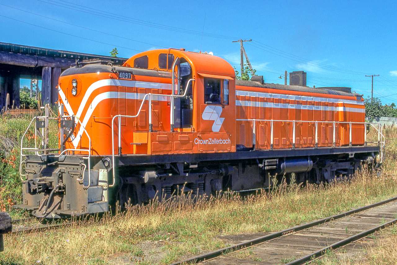 Crown Zellerbach 4097 is in Ladysmith, British Columbia on August 7, 1974. 
The original slide had almost total shadow on the trucks, etc., but thankfully Lightroom and Photoshop helped pull out some truck detail.