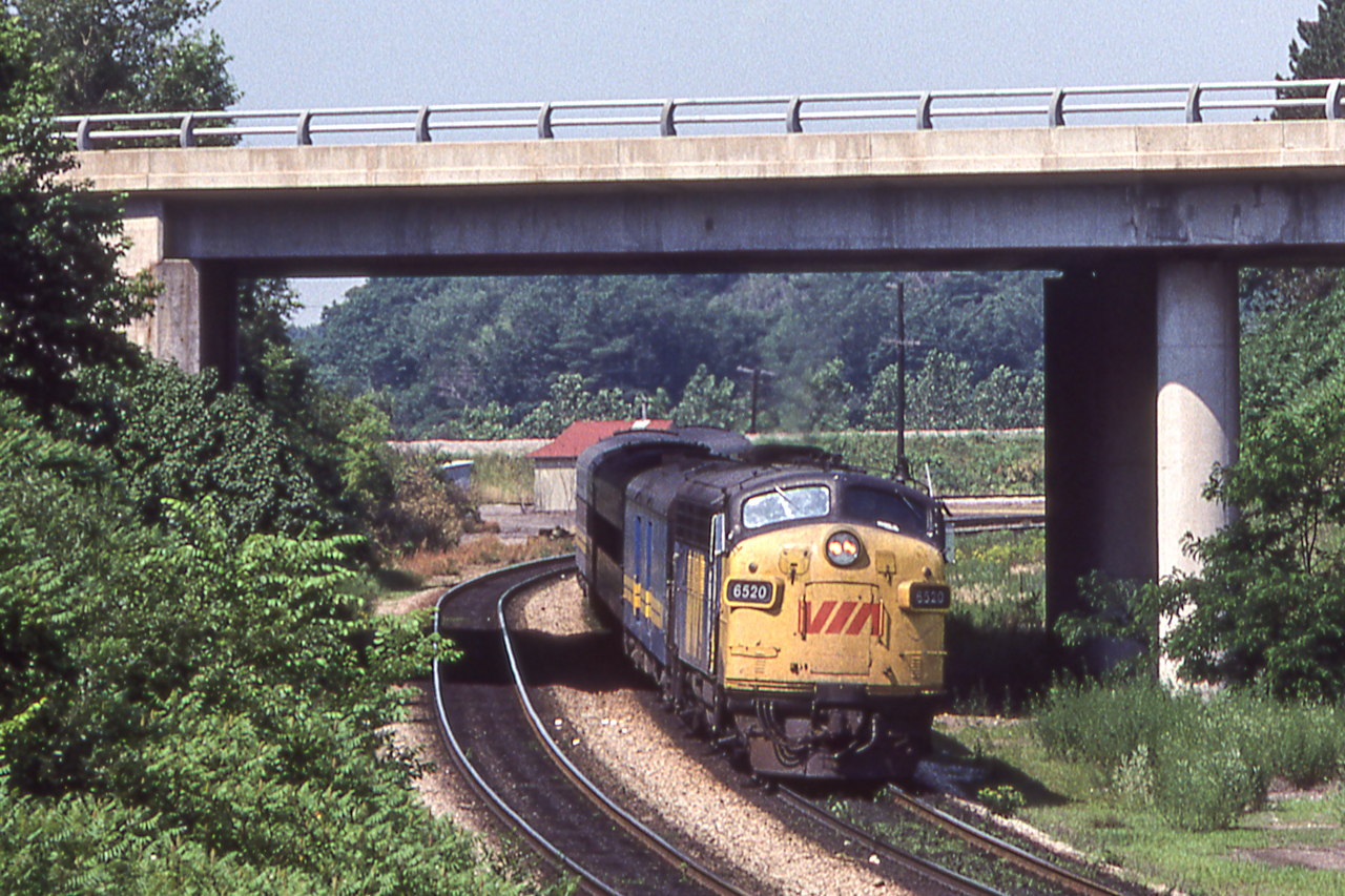 VIA 6520 will soon be at Bayview Junction as she heads east in Hamilton, Ontario in June 1981.