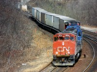 So I found Part 2 which was actually part 1. The Hotshot ran around the other westbound at Bayview to lead it up the hill. The second unit is a Conrail GP38-2; foreign power being pretty rare in those days. It seems odd ot see TOFC in well cars, but that is where they began in Canada; CN "Laser" service.