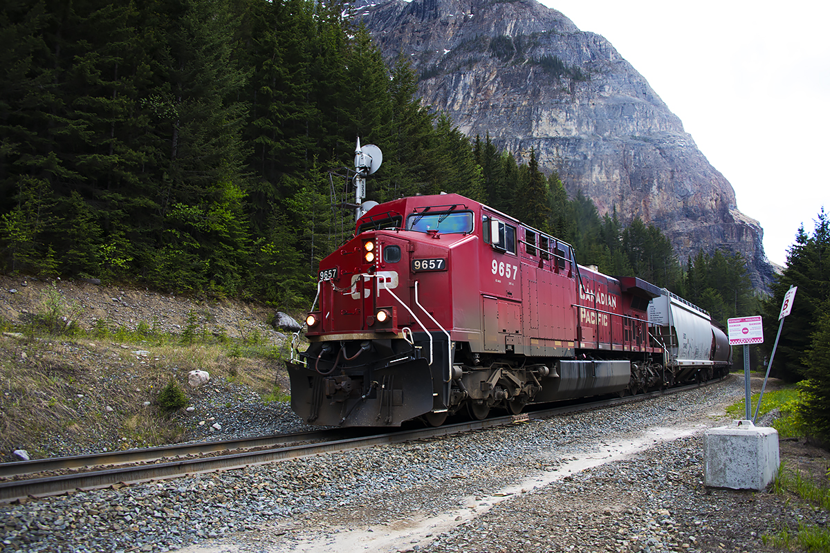 Grain empties pass the remnants of the Cathedral Siding. I assume if was removed as part of the "Hunterising" of CP, it being a siding that was relatively short, and un-extendable due to tunnels at both ends. I suspect CP doesn't run many 6000 foot trains down the Laggan Sub, so pulling it up appears to make sense. I guess it just puts additional pressures on the RTC to judge meets at Partridge siding; 5 miles and 15+ minutes away. Getting trains out of Field to set up meets with West bounds climbing out of Lake Louise must be a great skill; especially in winter.