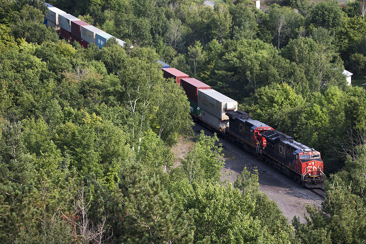 The, for obvious reasons, much less photographed approach to the Seguin River Trestle. 2103 trails on westbound stacks. As I walked in circles around the tower for about an hour, I couldn't help but ponder what this scene must have looked like in the days of steam. Did 2816 pass over the bridge southbound on tour, of just northbound in Arnold Mooney's brilliant shot; http://www.railpictures.ca/upload/cps-old-steam-engine-2816-is-seen-crossing-the-parry-sound-trestle-on-its-way-back-to-the-north-and-west-after-a-tour-of-southern-ontario-much-to-the-delight-of-the-fans-one-can-see-the-railfans. And what must it have looked like in winter in the 50's and 60's.........