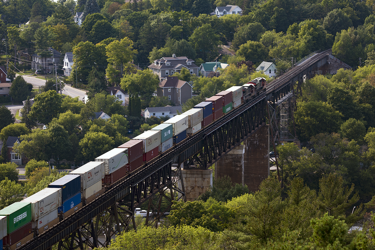 Northbound stacks cross the Seguin River. Is it time to lobby the railroads to reverse direction running every 2 years just to balance rail wear an tear?
