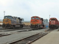 A pair of foreign GE ES44AC's including "lucky" BNSF 7777 are parked by some stored SD40-2's.