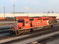 All alone on the west end of the shop SD40-2 5876 gets the warm glow of a late evening sun.