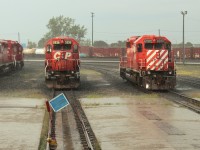 A pair of dash 2's get caught in a sudden downpour. The active 5936 and the still on the roster 6080.