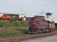 <b>Who's Railway Is This?!</b> The competition has showed up to Mac Yard leading CN 394, the incoming crew now heads to the shops ducking under the hump while an SD40 hump set awaits it's next assignment.