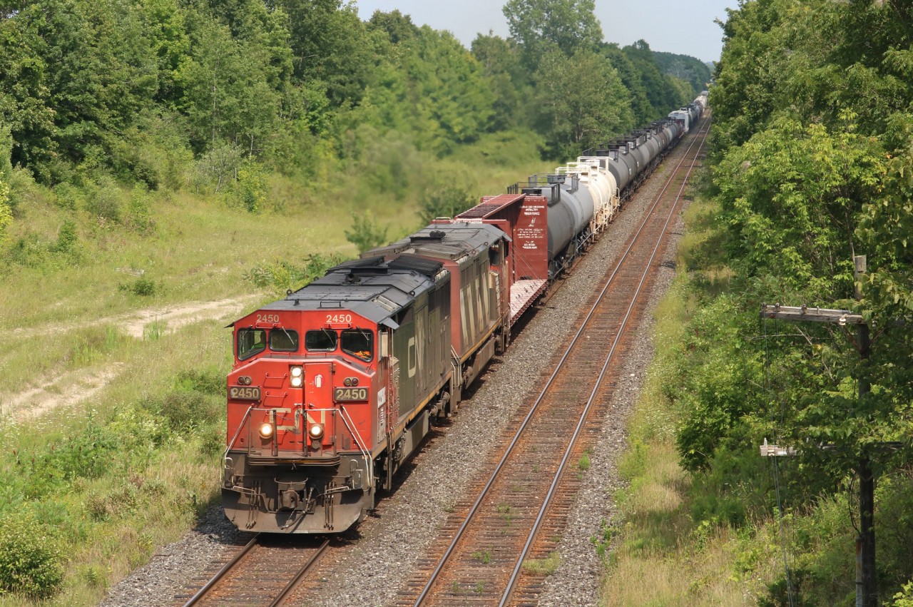 A pair of C40-8Ms lead M331 under the Canning Rd. bridge after lifting at Paris.