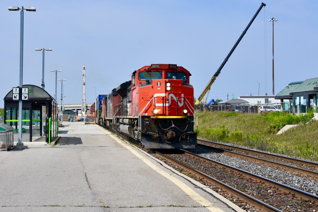 CN sd70m-2 8819 leads the daily intermodel freight eastbound through Bramalea nearing its destination at BIT obeying its regular speed restriction for this point on the journey traveling no more than 10mph. Note the cranes I managed to capture overhead on either sides of the train working on the platform and parking lot. Progress is being made at Bramalea in terms of platform expansion as well as improvements of the parking lot, bus shelters etc. In a couple years we may see this happening at Mount Pleasant GO as well. Doubt there’s room for a platform expansion at the downtown Brampton GO/VIA station so looks like the passengers getting off there will have to make sure they are in a Bombardier that will open when the train nears the station.