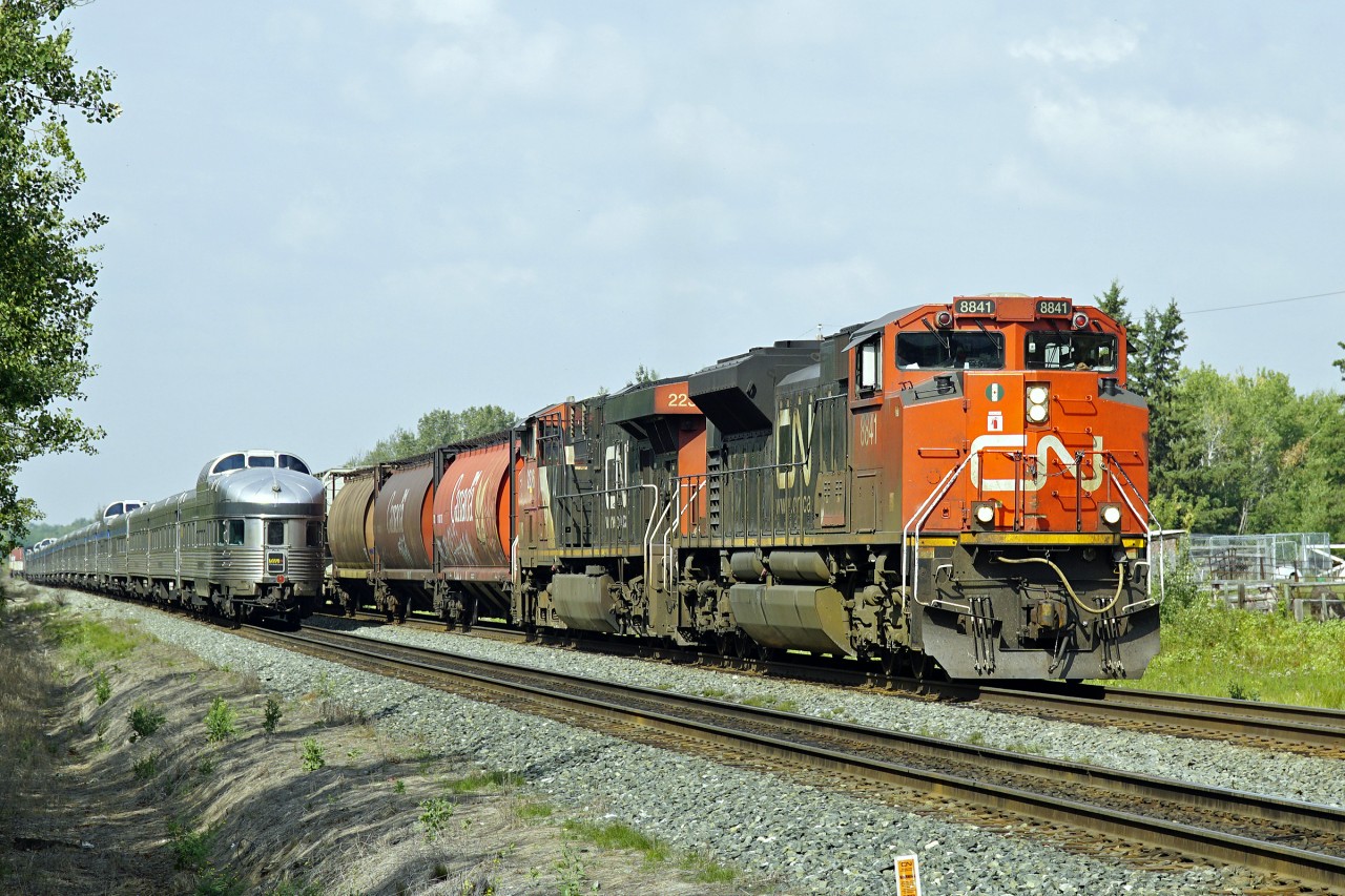 SD70M-2 CN 8841 and ES44DC CN 2236 start away from Ardrossan eastward as VIA #1 running 4 Hours +/- late waits patiently behind a westbound freight before itself getting the road on down into Edmonton.