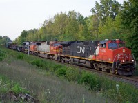 As dusk approaches, fortunately there are no shadows as CN train 383 heads west through mile 30 Halton sub with CN 2536, PRLX 203, and CN 5778; NS 3639 was the DPU!