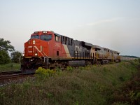 There's still enough light for one final shot of detour train 323 (Kirk Yard-Symington) as it approaches Ash on the Halton sub with CN ES44AC 2992 and two leased CREX units, the 1516 and 1434. After a crew change, this train will head for Winnipeg via Northern Ontario.