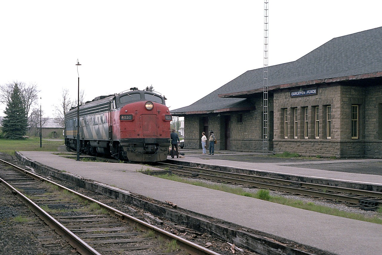 Carleton Place CP station was declared a heritage structure in 1994. Beautiful old sandstone structure. Here, in better days, when there at least used to be track here, CN 6535 and VIA 6621 slow up with VIA #2, Montreal-bound. 'CN' removed from the nose, unit soon to be painted in VIA colours. CP line pulled up 2012.