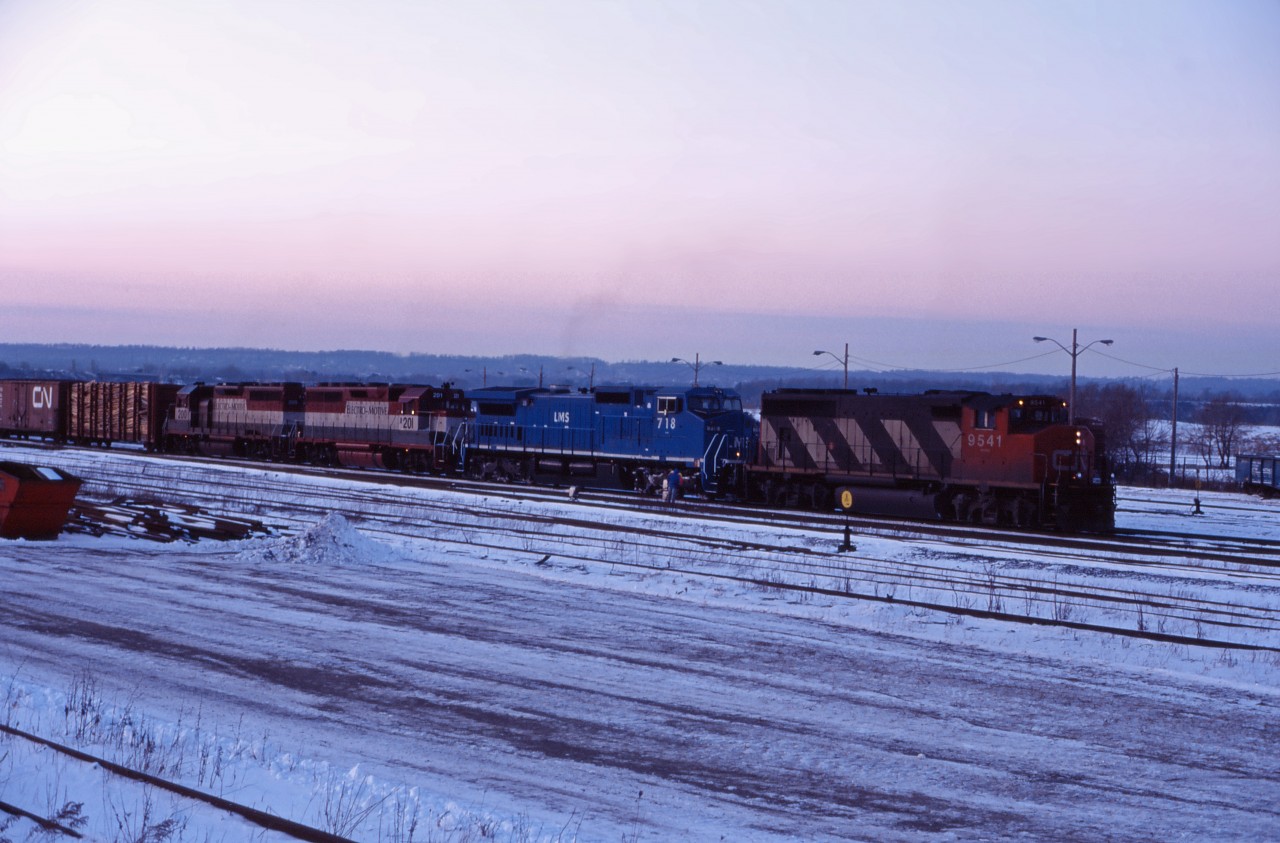 As this photo is being submitted, it's another hot humid day in southern Ontario. So let's cool things down a bit with a winter shot from 1995. Here we have CN GP40-2L2 9541,LMS C40-8W 718, and two EMD leasers (201 and 200) working Hamilton Yard.