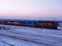 As this photo is being submitted, it's another hot humid day in southern Ontario. So let's cool things down a bit with a winter shot from 1995. Here we have CN GP40-2LW 9541,LMS C40-8W 718, and two EMD leasers (201 and 200) working Hamilton Yard.
