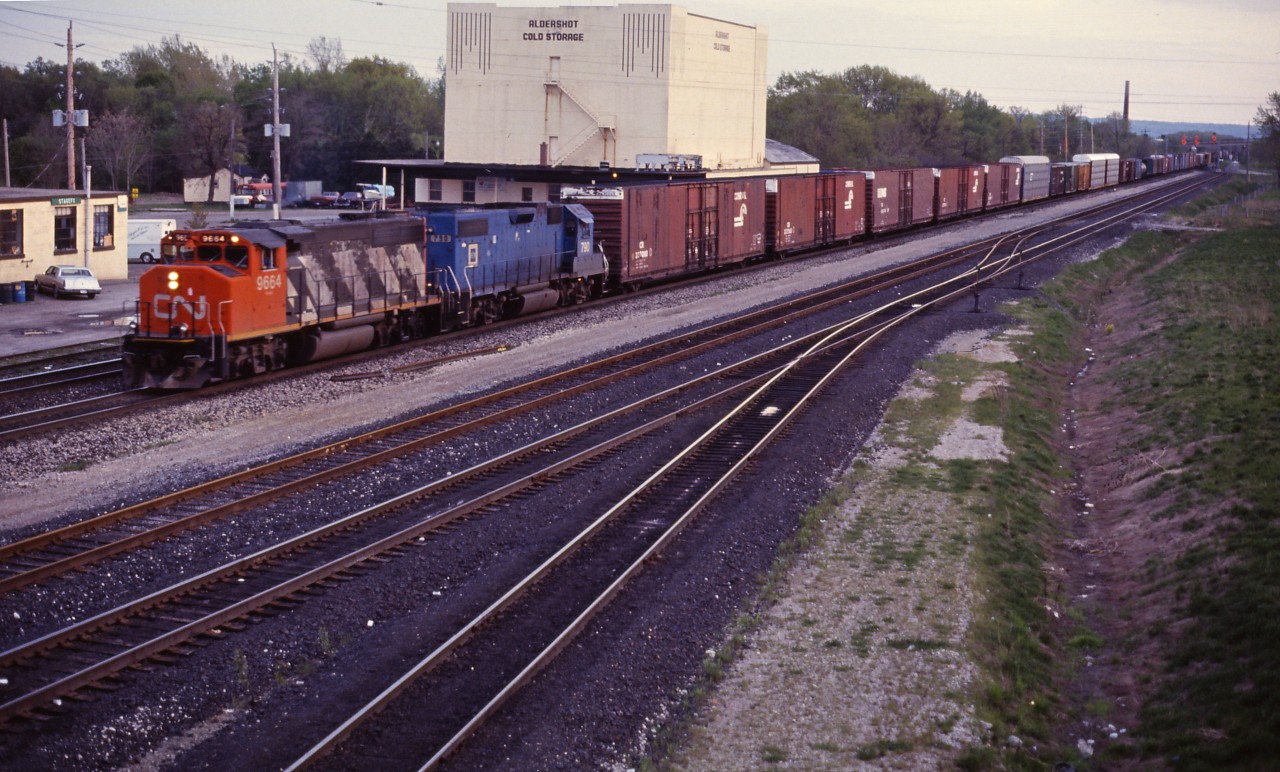 Our final shot of the evening is an eastbound powered by CN GP40-2W 9663 and EMDX GP38 790, a former Conrail unit on lease to CN.