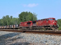AC4400CW CP 8616 and ES44AC CP 8735 sit idling in the siding at Wetaskiwin waiting to depart with their work train. 