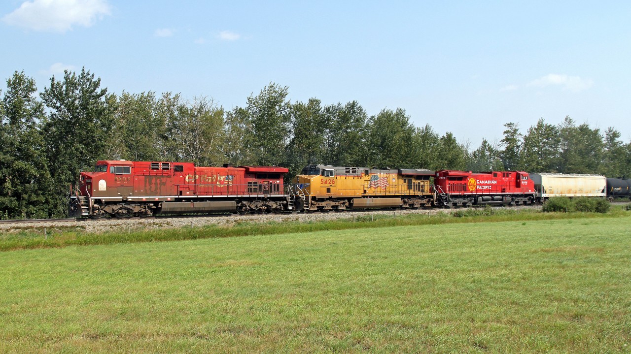 Nice lash up just pulling out of Wetaskiwin.  AC4400CW CP 9506, ES44AC UP 5426 and recently rebuilt, still looking sparklingly new AC44CWM CP 8006.