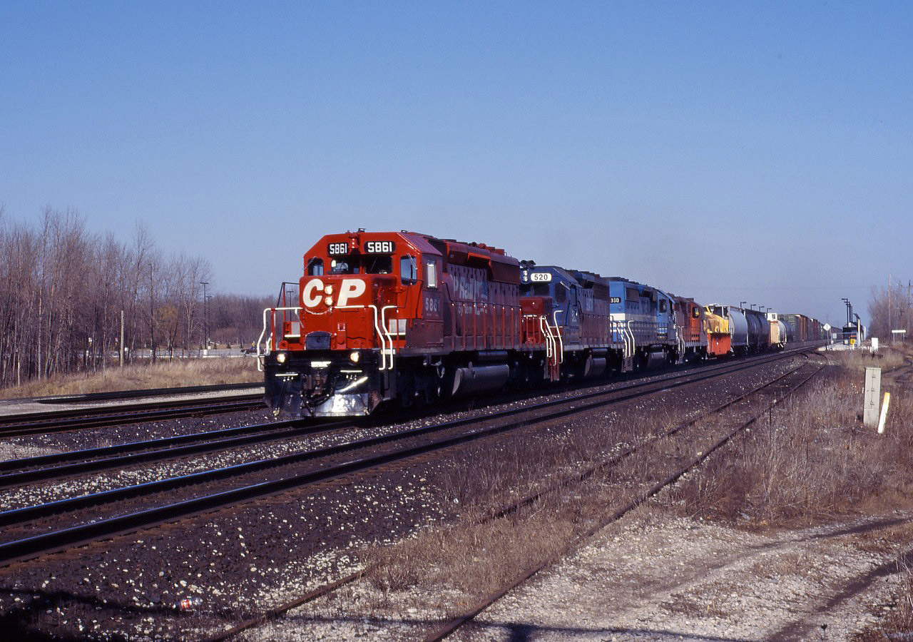 Here's another one of those wild 1990s lash-ups on CP--SD40-2 5861 in CP Rail System paint, leased HATX GP40 520, GATX SD40-2 7330, and a GP9u--exercising trackage rights on CN's Oakville sub.