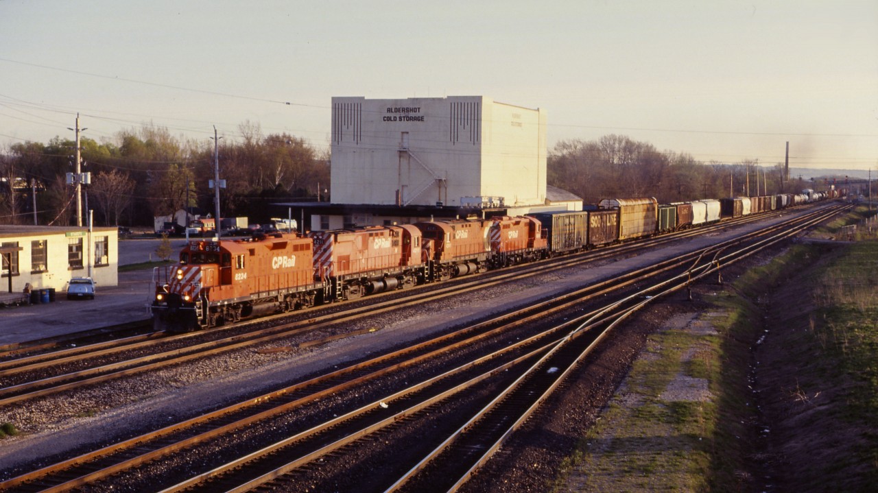 In a shot taken from the Waterdown Road overpass, here we see a fairly typical CP train exercising trackage rights over the Oakville subdivision--CP GP9us 8234 and 8235 bracketing C424s 4211 and 4241. At this time, CP typically operated trains in each direction between Toronto and Philadelphia (558/557), Niagara Falls and Ste. Therese (520/519), and Niagara Falls and Toronto (521, 522, and 523). (Plus trains 270/271 between Blue Island and Saratoga, NY over the Hamilton sub, according to the Canadian Trackside Guide.)