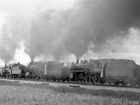 CPR 136, 815 and 1057 lead the famed triple header steam excursion of May 1st 1960, putting on an impressive smoke show heading through Erindale (Mississauga) near Mavis Road.