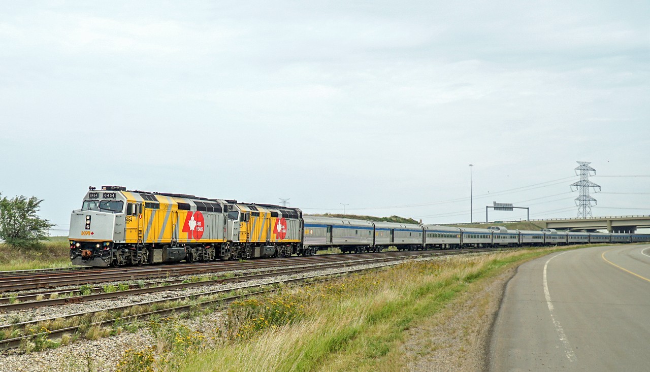 Running Close to 8 hours late VIA #1 drifts through Clover Bar with a pair of 40th anniversary locos upfront.