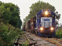 A new visitor to town, GMTX 2695 (a former SCL GP40) leads a GP9 and a 29 car local down the CASO on their way to switch industries on Windsors east end. Supposedly more of these GMTX GP40's are on their way to CN. 