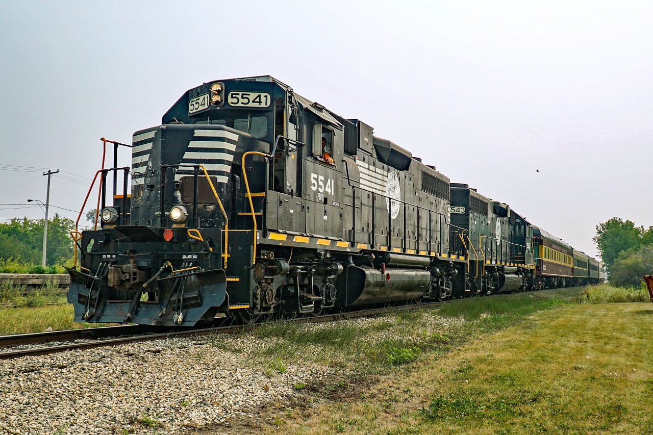 The "Wheatland Express" departs Cudworth on route to Wakaw headed by GP38-2s 5541 and 5543.