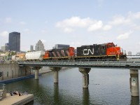 CN 7054 & CN 4707 lead a short transfer out of the Port of Montreal as they cross the Lachine Canal.