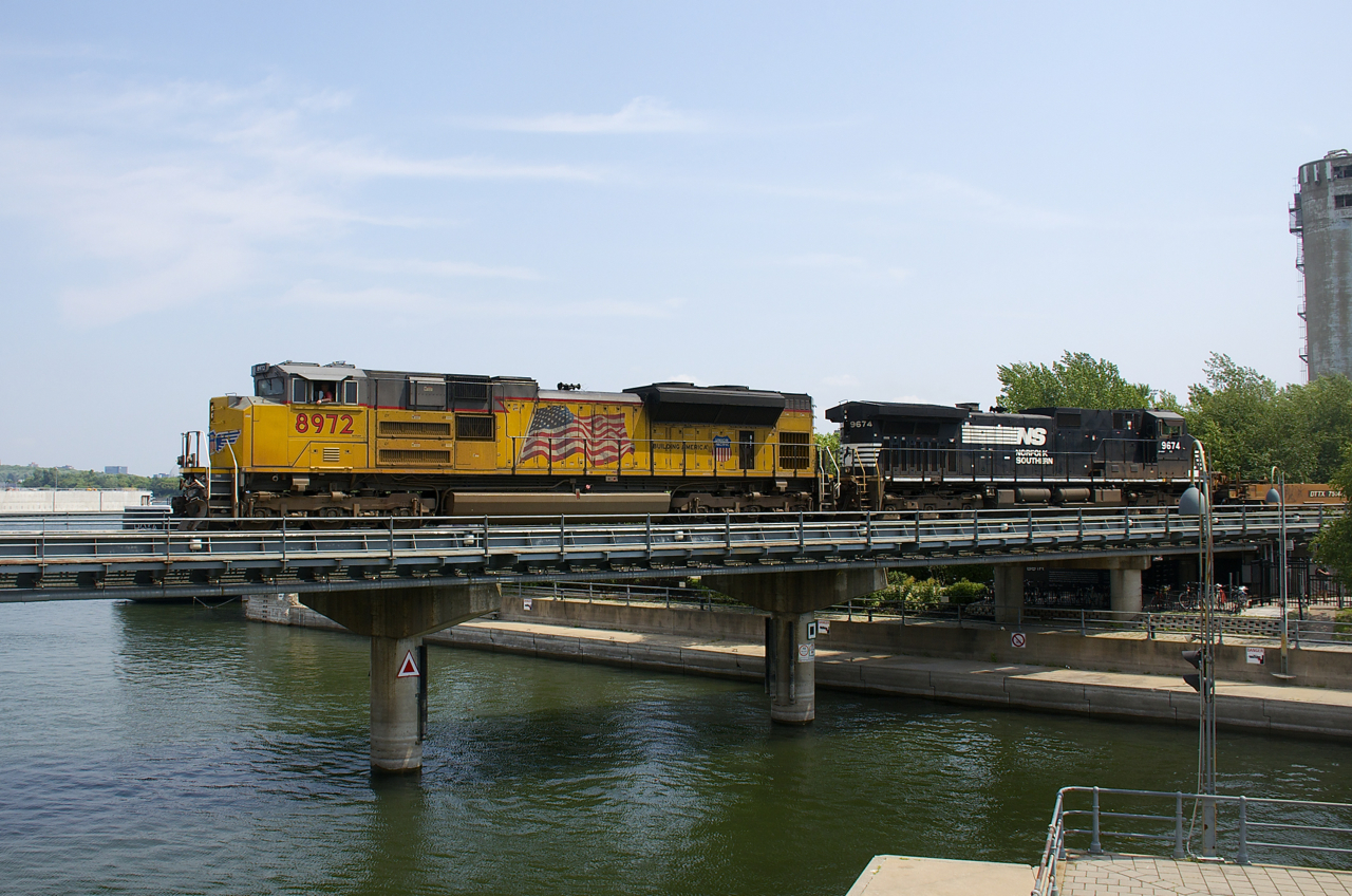 CN 543 (with UP 8972 & NS 9674 for power) is crossing the Lachine Canal with baretables for the Port of Montreal.
