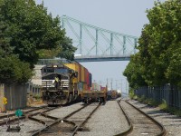 CN 543 (with NS 9674 & UP 8972 for power) is getting ready to leave the Port of Montreal with a cut of intermodal cars. At right are baretables which it had brought into the port.
