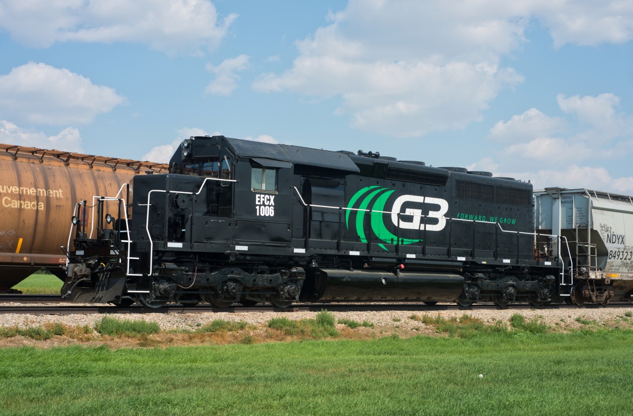 EFCX 1006 is seen here working at a grain elevator just east of Unity Saskatchewan. The paint job and re-numbering are quite recent occurrences. This SD40-3 is a former DLCX, BNSF unit that was originally built as a CN SD40.