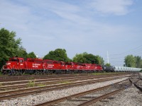 CP F94 has four GP20C-ECO's and a GP38-2 for power (CP 2304, CP 2229, CP 2261, CP 4417 & CP 2205) as it passes the empty Lasalle Yard. The train mostly consists of what seems to be new concrete hoppers, lettered WFRX.