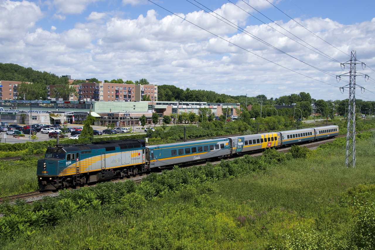 VIA 35 consists of VIA 6434 and four LRC cars it heads west through Pointe-Claire.