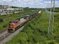 PRLX 201 (an SD75M built for the ATSF in 1995) is the surprising leader on CN 327 (with CSX 5323 & CSXT 45 trailing), as these units rarely lead in Canada. Also somewhat surprising is the not horrible patch job on the leader. It is seen about to pass MP 14 of CN's Kingston Sub in Pointe-Claire.
