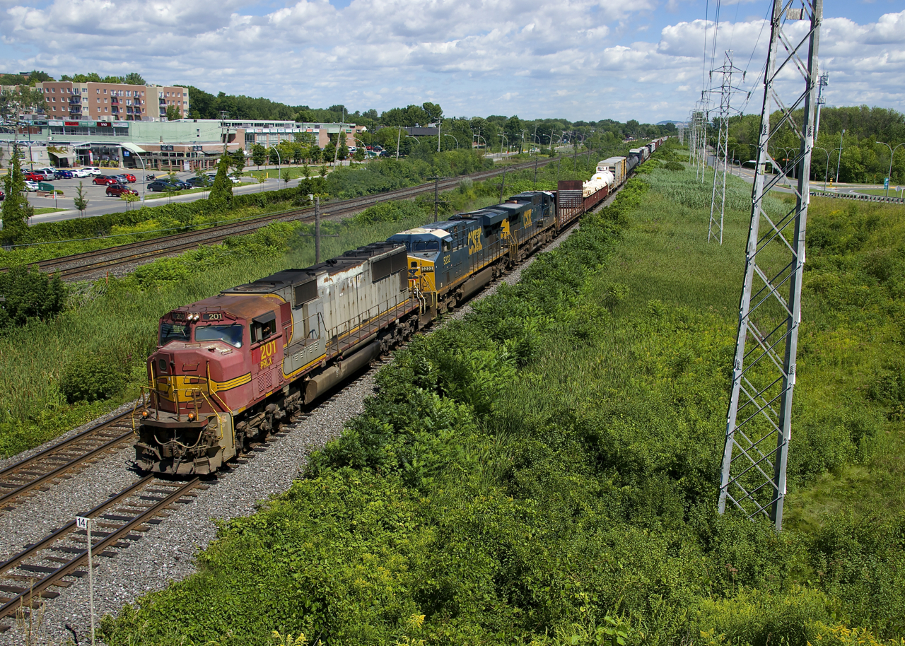 PRLX 201 (an SD75M built for the ATSF in 1995) is the surprising leader on CN 327 (with CSX 5323 & CSXT 45 trailing), as these units rarely lead in Canada. Also somewhat surprising is the not horrible patch job on the leader. It is seen about to pass MP 14 of CN's Kingston Sub in Pointe-Claire.