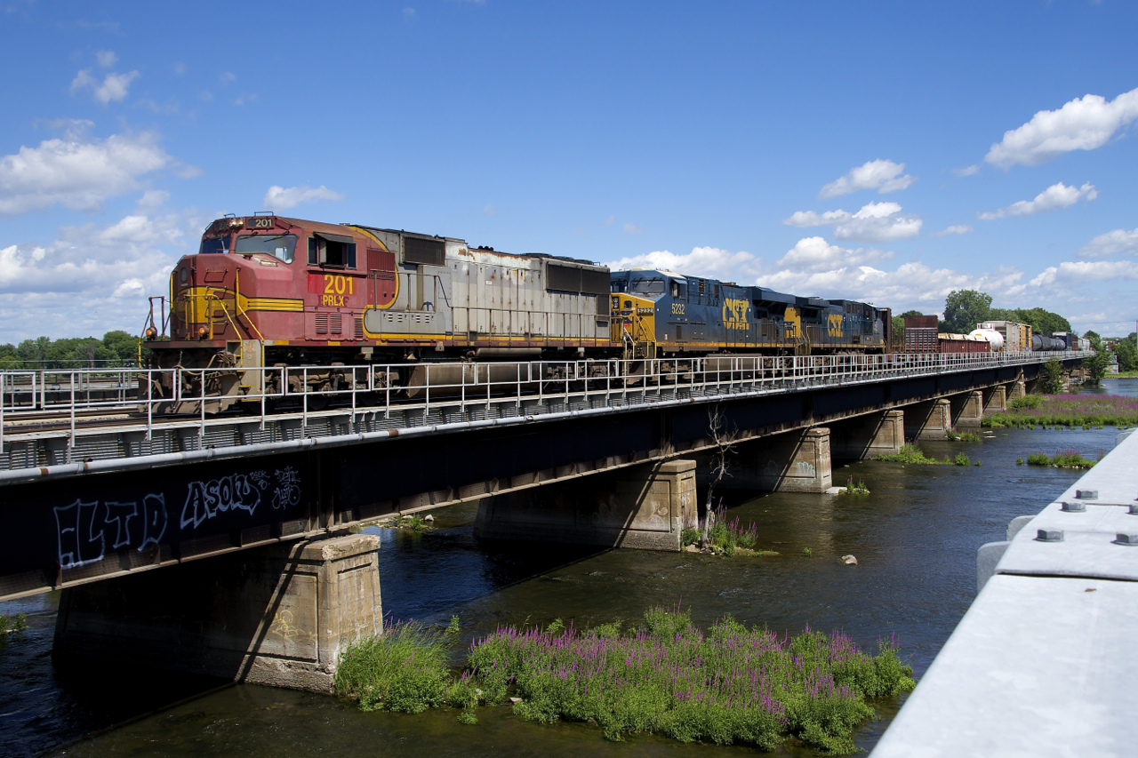 PRLX 201 (an SD75M built for the ATSF in 1995) is the leader on CN 327 as it crosses over the Ottawa River. CSXT 5323 and CSXT 45 are trailing.