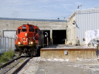 The Pointe St-Charles Switcher shoves a single boxcar into the Kruger plant that is located at the end of the Turcot Holding Spur. A plastics car is ahead of the boxcar, as they will have to respot it after switching Kruger.