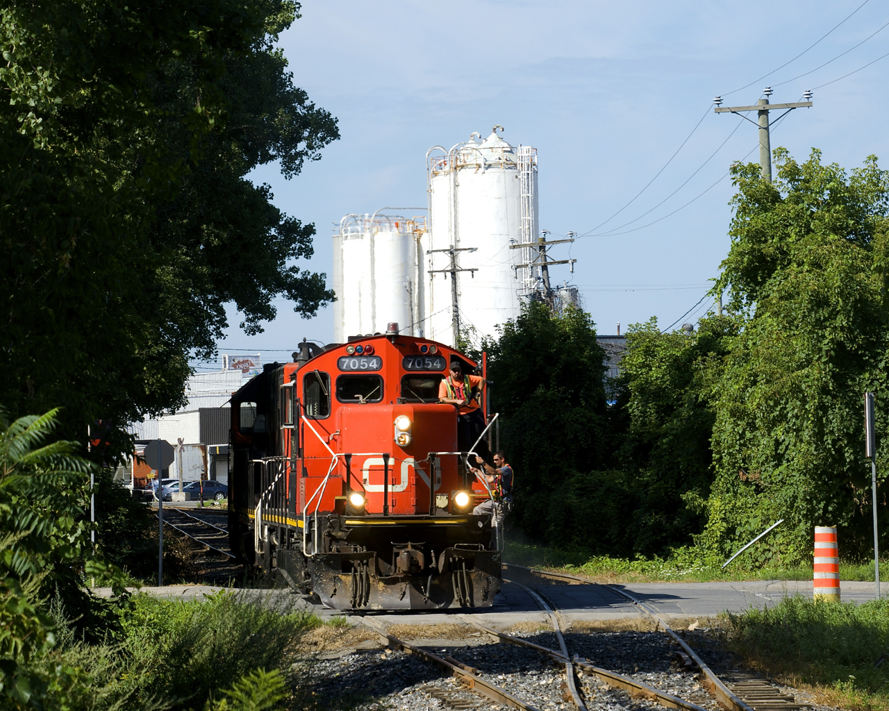 After dropping off a car the Kruger plant, the Pointe St-Charles Switcher is crossing Monk Boulevard, which they had just flagged.