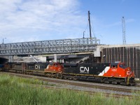 A very clean ES44AC (CN 2962) leads a pair of grubby SD70M-2's (CN 8942 & CN 8019) as CN 120 exits the short tunnel that takes the CN tracks under the Turcot interchange. In the foreground is the lead to the Turcot Holding Spur. The tracks CN 120 is on are not long for this world, with a new right of way further north entering service shortly.
