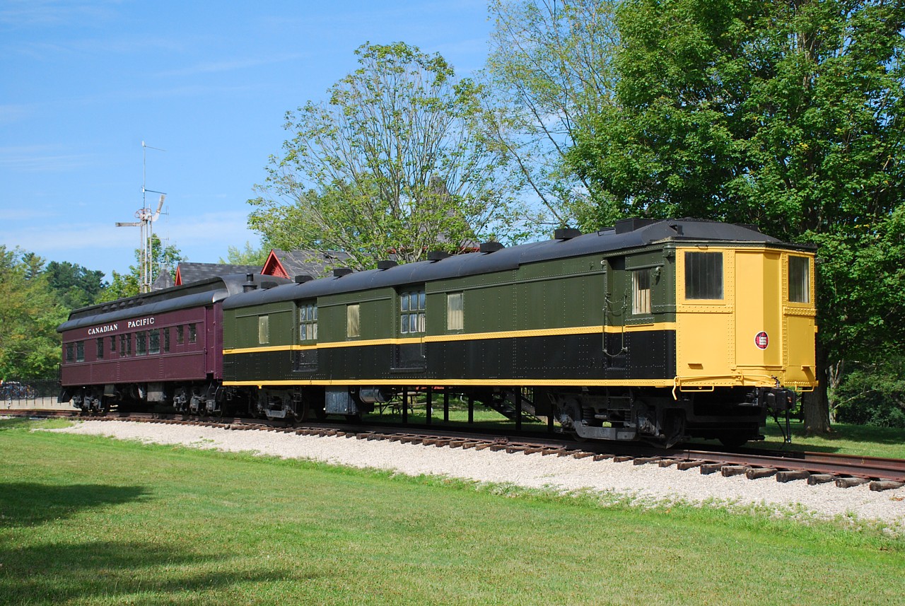 The boys and I went for a hike near Sulphur Springs today and ended up at the Sulphur Springs Trail Centre.  Arnold posted a photo not too long ago taken in 1983 that cannot be replicated today due to the presence of another small building built next to the faux-station, and some trees that have grown pretty big in 35 years.  I'm happy to report that in the year since Terry's photo the Hamilton Conservation Authority has given both cars a fresh coat of paint and they're looking pretty spiffy.  They aren't painted correctly, but a least they're well kept.  The trail centre is a nice place to take a break while hiking in the Dundas Valley.