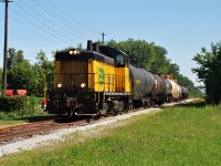 Essex Terminal SW9 #105 is seen here heading south through Lasalle en-route to Amherstburg with 6 cars for Honeywell and 3 for Diageo. In the summer of 2013, Honeywell shut down their operation in Amherstburg where they made hydrofluoric acid thus cutting freight on this local. Diageo is still a customer however and is currently switched about twice a week.