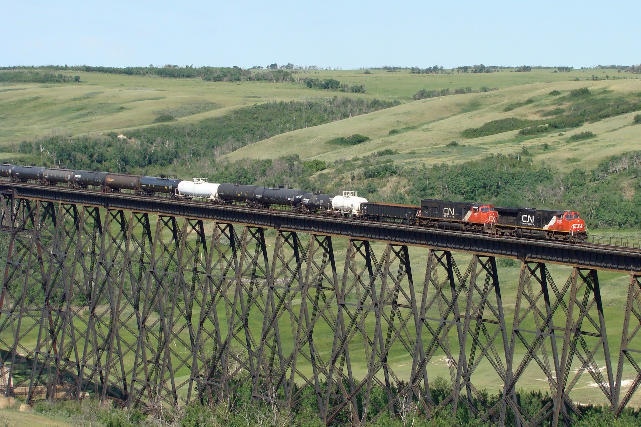 ES44DC, CN 2240 and SD75I, CN 5647 head east over the Battle River Trestle at Fabyan on there approach to Wainwright.