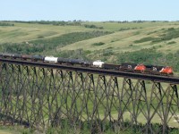 ES44DC, CN 2240 and SD75I, CN 5647 head east over the Battle River Trestle at Fabyan on there approach to Wainwright.
