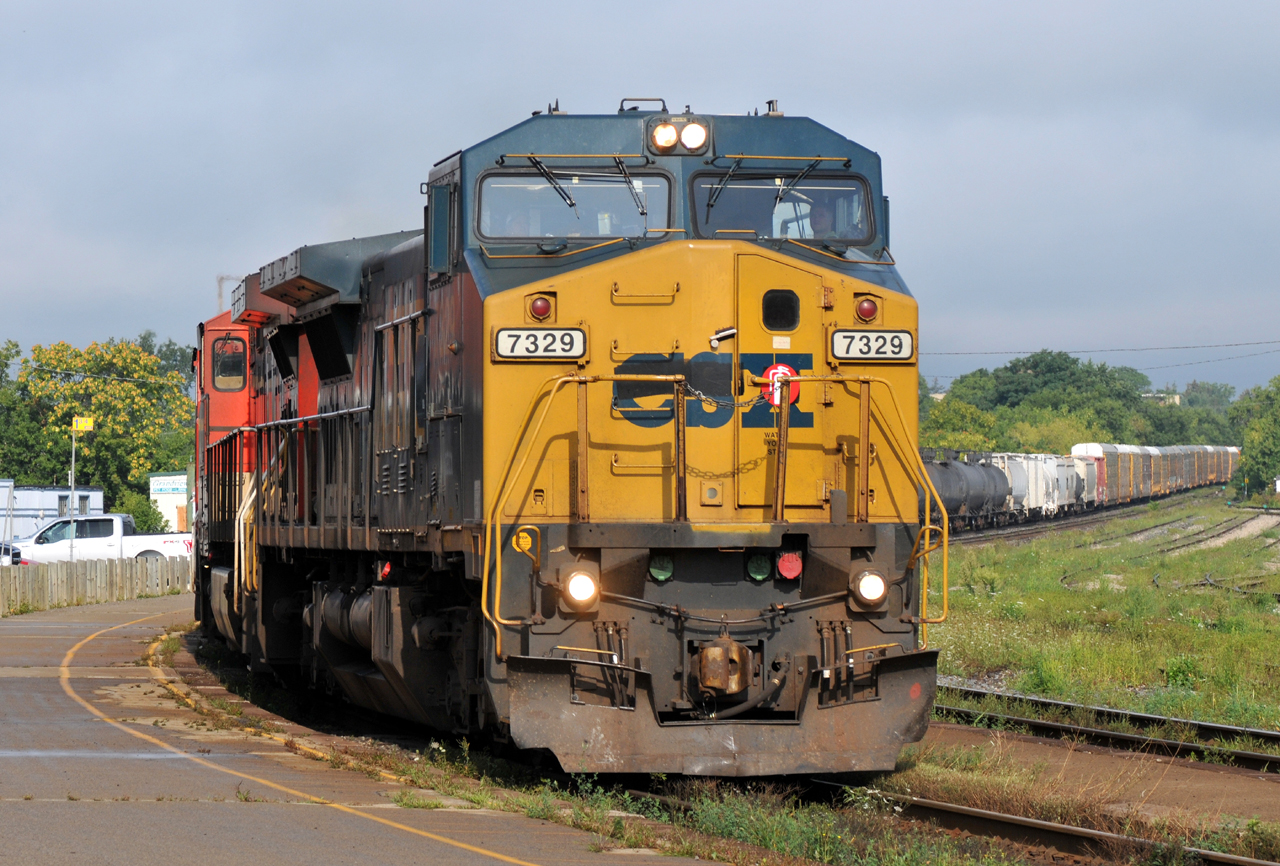 M39671 15 cruises through Brantford in some (surprising!) early morning sunlight. GECX 7329, IC 2722, CN 2448, and 159 make up the consist