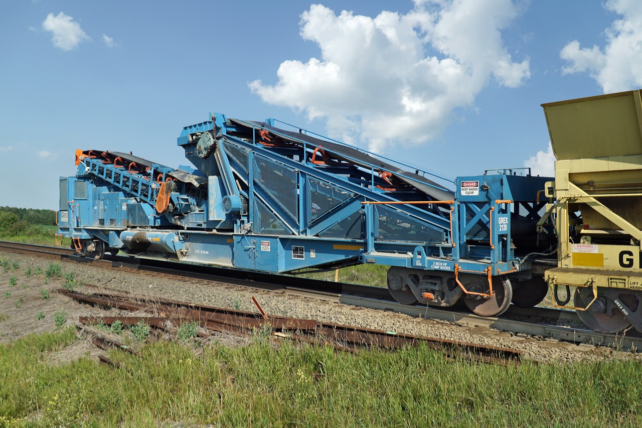 This is the business end of the GREX dump train.  This system can deliver 2000 tons/hour of balalst or agregate to the track or up to 52ft to the side of the track.