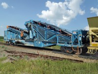 This is the business end of the GREX dump train.  This system can deliver 2000 tons/hour of balalst or agregate to the track or up to 52ft to the side of the track.