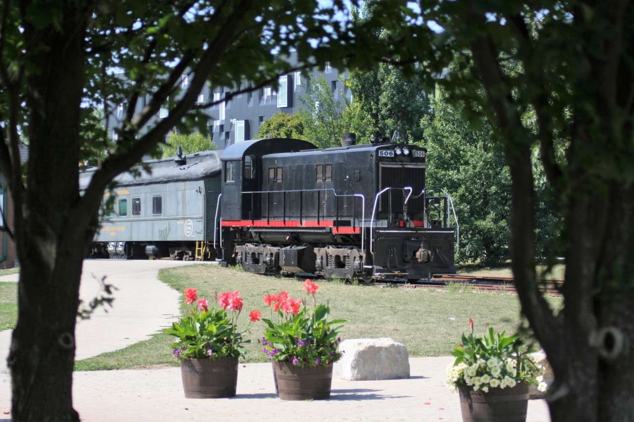 Ontario Southland Railway RS-23 506 is seen with St. Thomas Central Railway equipment in Waterloo, Ontario by the station that was once home to the Waterloo-St. Jacobs Railway (WSJR).