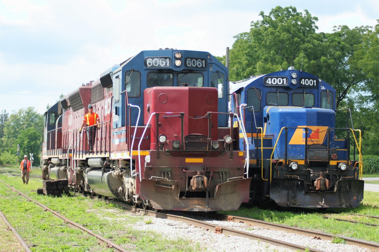 Goderich-Exeter Railway (GEXR) train 581 with HLCX SD40M-3’s 6061 and 6522 is seen idling beside GEXR 
GP9 4001 at Clinton, Ontario on the railway’s Goderich Subdivision. The pair of SD40M-3’s has just set-off 4001, as it will be assigned to an upcoming job operating on the former CN Exeter Subdivision. Soon, 581 will continue its journey to Stratford with tonnage lifted at Goderich and the units will then have little rest, being assigned to train 432 later in the afternoon and heading to Toronto.