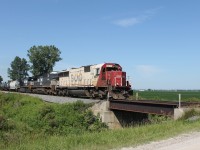 Around milepost 73 on the Windsor Subdivision, SOO 6037 leads a pair of NS units on a loaded ethanol train.